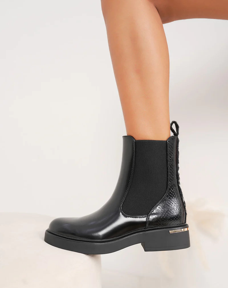 Bottines femme noires tendance style Chelsea avec paillettes arrière et semelle crantée