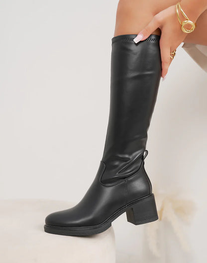 Bottes femme noires élégantes à talon épais moyen et bout rond fourré